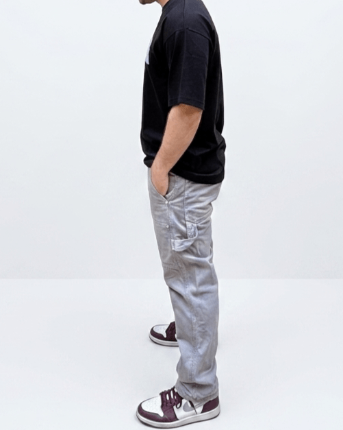 Side view of black oversized minimal blue graphic T-shirt