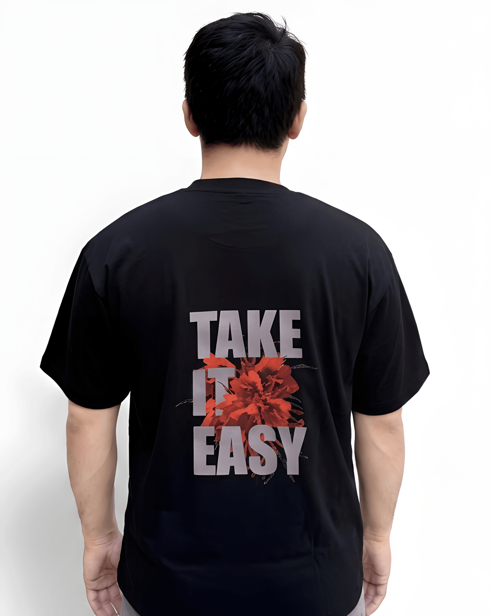 Black oversized Take It Easy print t-shirt back close-up showing detailed graphic artwork and fabric texture