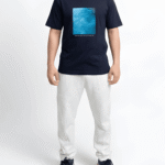 Navy blue oversized graphic print t-shirt front close-up showing premium cotton fabric and artwork detail