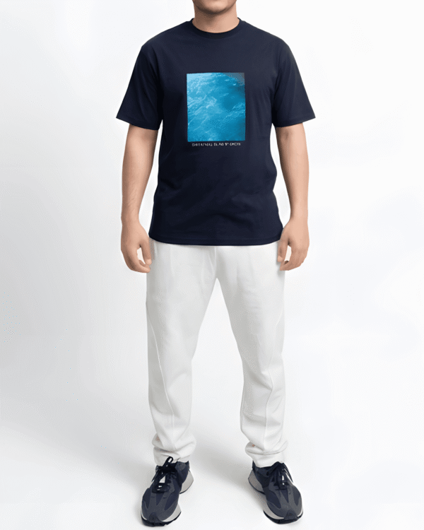 Navy blue oversized graphic print t-shirt front close-up showing premium cotton fabric and artwork detail