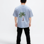 Sky Blue Oversized Graphic T-Shirt Back View with White Print – Premium Cotton Unisex Streetwear Tee