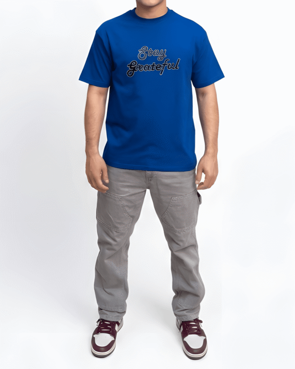 Royal blue oversized graphic print unisex t-shirt front view with modern streetwear artwork