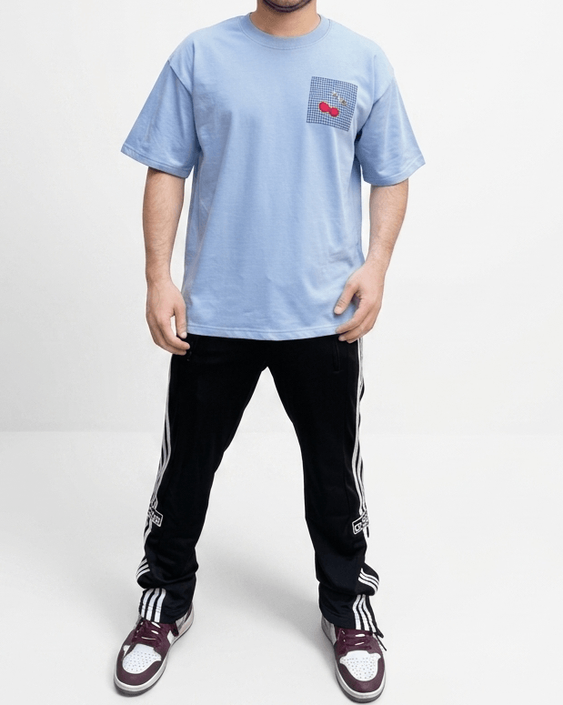 Sky blue oversized embroidered T-shirt front view featuring premium cotton fabric and a relaxed drop-shoulder fit.