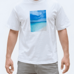 Close-up of white oversized T-shirt with blue graphic print